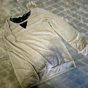 Dark gray with distressed back black lace peeking through long sleeve top